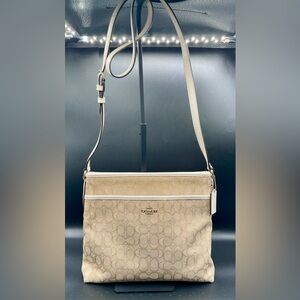 COACH Signature File Bag in Light Khaki and Chalk Canvas with Leather Trim.